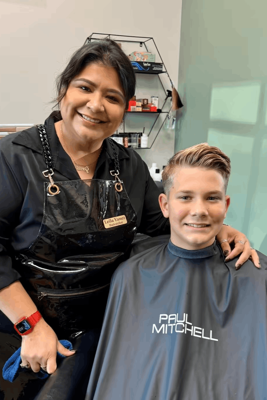 Hairstylist working on client